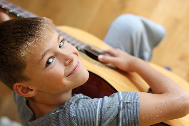 Boy playing Guitar